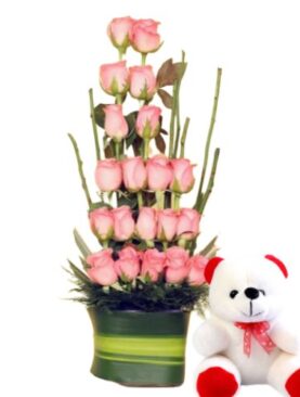 Glass Vase Arrangement Of Pink Roses With a Teddy